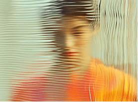 Abstract blurred portrait behind glass texture